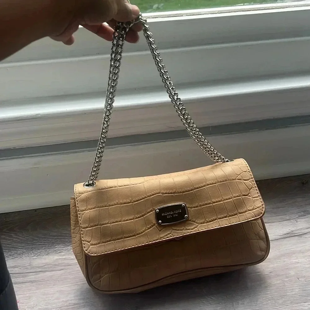 Tan Michael Kors envelope chain crossbody purse with adjustable straps